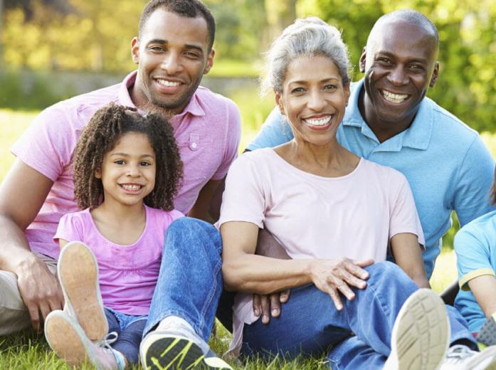 family of four smiling