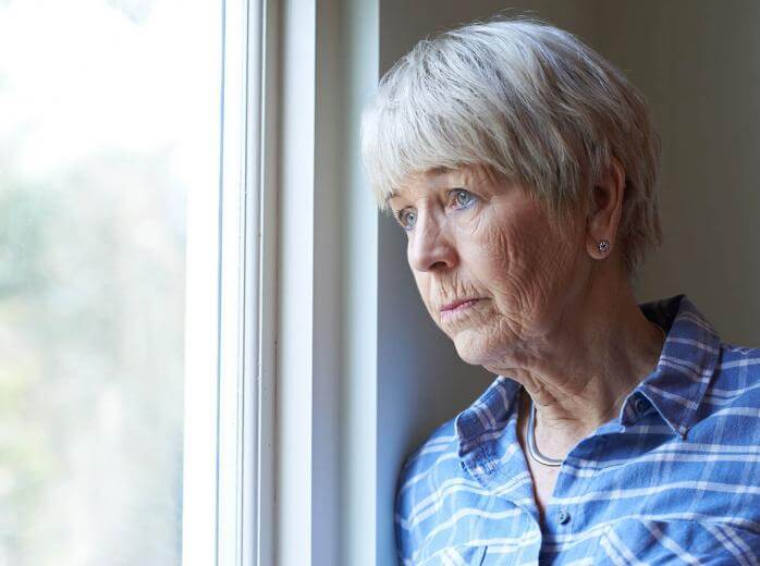 woman looking out window